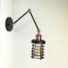 antik-fali-olvaso-lampa-matt-fekete-antik-vorosrez-szin-csepp-alaku-raccsal